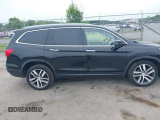 2017 Honda Pilot Touring with VIN 5FNYF6H90HB052474, listed as a IAAI auction lot 42291464 with 103,288 mi miles and . Bid and sale history available at DreamBid. Image 13.