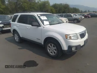 2008 Mazda Tribute Touring with VIN 4F2CZ96138KM32735, listed as a IAAI auction lot 31145122 with 206,608 mi miles. Bid and sale history available at carsss.com. Image 1.