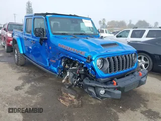 2024 Jeep Gladiator Mojave X z VIN 1C6JJTEG5RL121313, wystawiony jako IAAI lot #41013599 z przebiegiem 2 952 mil mil oraz . Historia ofert i sprzedaży dostępna na DreamBid. Obrazek 1.