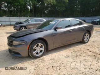 2019 Dodge Charger SXT with VIN 2C3CDXBG7KH725232, listed as a Copart auction lot 59076715 with 98,327 mi miles and Salvage title. Bid and sale history available at DreamBid. Image 1.