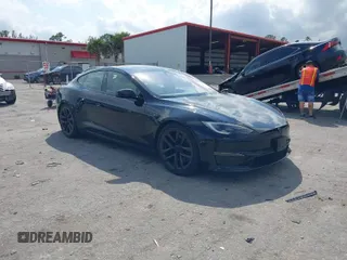 2023 Tesla Model S with VIN 5YJSA1E59PF502078, listed as a IAAI auction lot 41766041 with 26,546 mi miles and . Bid and sale history available at DreamBid. Image 1.