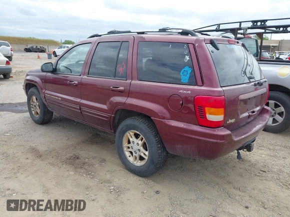 1999 Jeep Grand Cherokee Limited with VIN 1J4GW68N3XC696825, listed as a IAAI auction lot 42117857 with 236,300 mi miles. Bid and sale history available at carsss.com. Image 3.