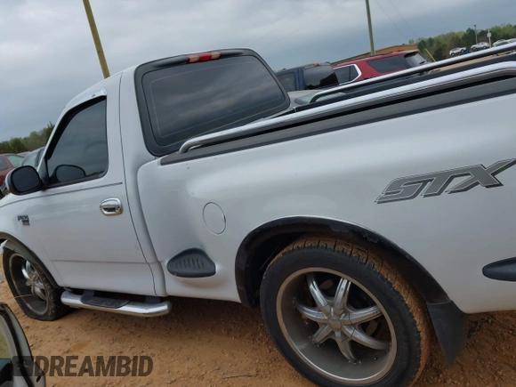 2003 Ford F-150 with VIN 2FTRF07W43CA38120, listed as a IAAI auction lot 41944774 with 195,327 mi miles and . Bid and sale history available at DreamBid. Image 14.