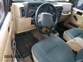2002 Jeep Wrangler Sahara with VIN 1J4FA59S22P771136, listed as a Copart auction lot 51528665 with 236,882 mi miles and Salvage title. Bid and sale history available at DreamBid. Image 8.