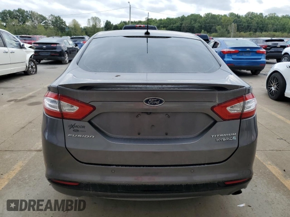2013 Ford Fusion Titanium Hybrid with VIN 3FA6P0RU9DR309263, listed as a Copart auction lot 72704284 with 157,035 mi miles and Non Repairable. Bid and sale history available at carsss.com. Image 7.