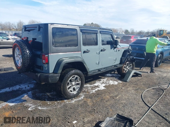 2015 Jeep Wrangler Unlimited Willys Wheeler with VIN 1C4BJWDG4FL589822, listed as a IAAI auction lot 41732614 with 149,112 mi miles and . Bid and sale history available at DreamBid. Image 4.