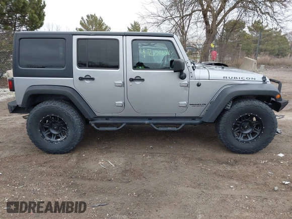 2013 Jeep Wrangler Unlimited Rubicon z VIN 1C4BJWFG7DL667083, wystawiony jako IAAI lot #42016912 z przebiegiem 148 933 mil mil oraz . Historia ofert i sprzedaży dostępna na DreamBid. Obrazek 13.