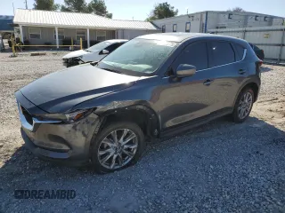 2020 Mazda CX-5 Grand Touring with VIN JM3KFADM3L0803536, listed as a Copart auction lot 52603775 with 89,926 mi miles and Salvage title. Bid and sale history available at DreamBid. Image 1.