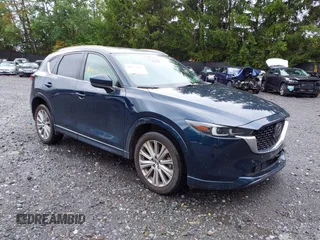 2023 Mazda CX-5 Signature with VIN JM3KFBXY4P0153335, listed as a IAAI auction lot 40053867 with 17,828 mi miles and . Bid and sale history available at carsss.com. Image 1.
