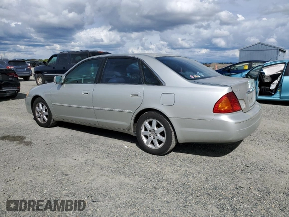 2000 Toyota Avalon XL with VIN 4T1BF28B3YU002835, listed as a Copart auction lot 50902115 with 128,699 mi miles and Salvage Title. Bid and sale history available at DreamBid. Image 2.