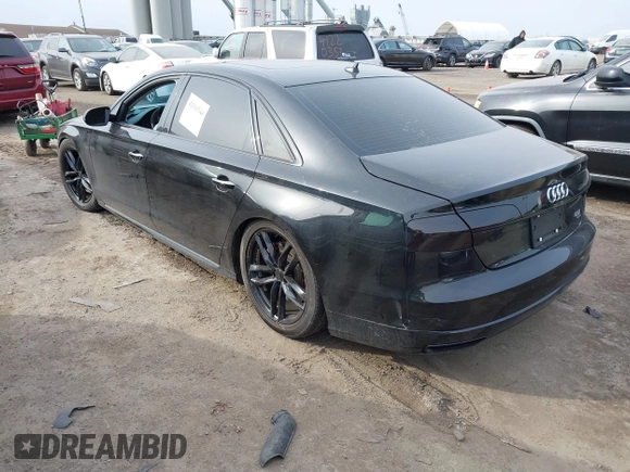 2016 Audi A8 L 4.0T Sport with VIN WAU43AFDXGN005323, listed as a IAAI auction lot 41311344 with 84,000 mi miles. Bid and sale history available at carsss.com. Image 3.
