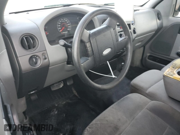2007 Ford F-150 STX with VIN 1FTRF02297KD15057, listed as a Copart auction lot 73847974 with 184,413 mi miles and Salvage Title. Bid and sale history available at carsss.com. Image 8.