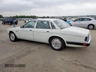 1994 Jaguar XJ with VIN SAJKX1743RC698636, listed as a Copart auction lot 56376685 with 192,928 mi miles and Salvage title. Bid and sale history available at DreamBid. Image 2.
