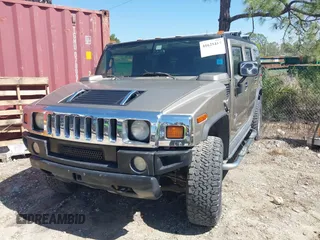 2005 Hummer H2 SUV with VIN 5GRGN23U85H129007, listed as a IAAI auction lot 41625417 with 102,389 mi miles. Bid and sale history available at carsss.com. Image 2.
