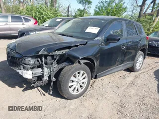2014 Mazda CX-5 Touring z VIN JM3KE4CY4E0328880, wystawiony jako IAAI lot #42112302 z przebiegiem 185 228 mil mil oraz . Historia ofert i sprzedaży dostępna na DreamBid. Obrazek 18.