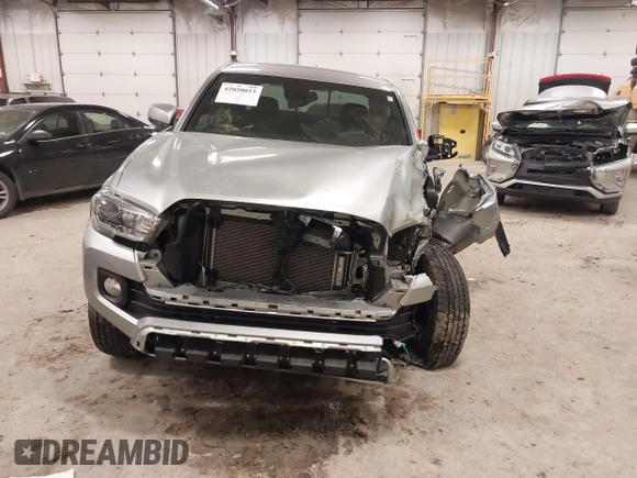 2023 Toyota Tacoma SR z VIN 3TMCZ5AN4PM597509, wystawiony jako IAAI lot #42020023 z przebiegiem 36 941 mil mil oraz . Historia ofert i sprzedaży dostępna na DreamBid. Obrazek 6.