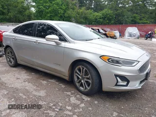 2019 Ford Fusion Titanium with VIN 3FA6P0RU4KR117407, listed as a IAAI auction lot 42380448 with 148,878 mi miles and . Bid and sale history available at DreamBid. Image 1.