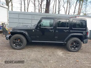 2015 Jeep Wrangler Unlimited Sahara with VIN 1C4HJWEG0FL661723, listed as a IAAI auction lot 41998393 with 89,077 mi miles. Bid and sale history available at carsss.com. Image 14.