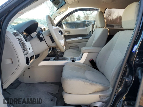 2010 Mercury Mariner с VIN 4M2CN8BG2AKJ19773, выставлен на аукционе Copart как лот 88138555 с пробегом Не указан миль и Списание • Salvage title. История ставок и продаж доступна на DreamBid. Изображение 7.