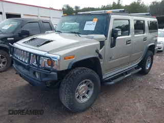 2005 Hummer H2 SUV with VIN 5GRGN23U65H101545, listed as a IAAI auction lot 41426274 with 293,821 mi miles. Bid and sale history available at carsss.com. Image 2.