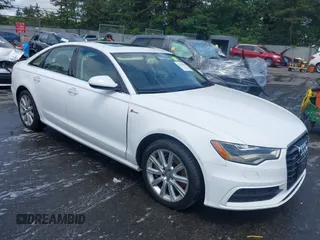 2014 Audi A6 Prestige z VIN WAUHGAFCXEN091050, wystawiony jako IAAI lot #42524560 z przebiegiem 169 575 mil mil oraz . Historia ofert i sprzedaży dostępna na DreamBid. Obrazek 1.