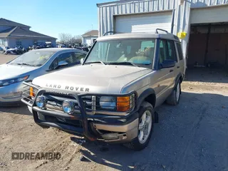 2000 Land Rover Discovery Cloth z VIN SALTY1247YA249969, wystawiony jako IAAI lot #42246445 z przebiegiem 188 643 mil mil oraz . Historia ofert i sprzedaży dostępna na DreamBid. Obrazek 2.