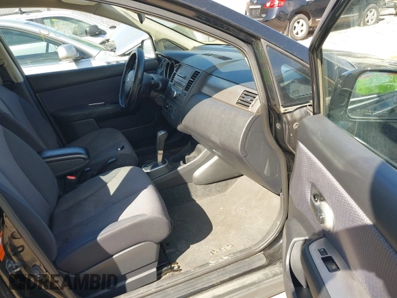 2009 Nissan Versa 1.8 S with VIN 3N1BC13E39L409657, listed as a IAAI auction lot 41981554 with 146,675 mi miles. Bid and sale history available at carsss.com. Image 5.
