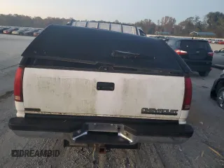 1996 Chevrolet Suburban z VIN 3GNFK16R7TG124404, wystawiony jako Copart lot #77361264 z przebiegiem 256 935 mil mil oraz Szkoda całkowita • Salvage title. Historia ofert i sprzedaży dostępna na DreamBid. Obrazek 6.