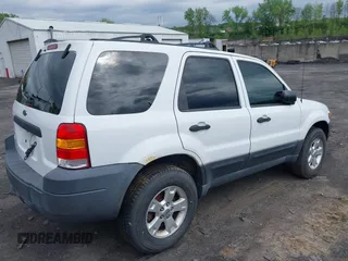 2005 Ford Escape XLT with VIN 1FMYU93135KA52035, listed as a IAAI auction lot 42224967 with 185,397 mi miles and . Bid and sale history available at DreamBid. Image 4.