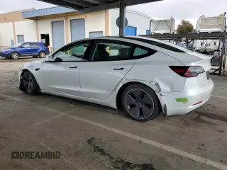 2023 Tesla Model 3 with VIN 5YJ3E1EA7PF488316, listed as a Copart auction lot 49655325 with 60,589 mi miles and Salvage Title. Bid and sale history available at DreamBid. Image 2.