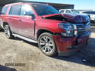 2016 Chevrolet Tahoe LTZ z VIN 1GNSKCKC9GR205745, wystawiony jako IAAI lot #41710241 z przebiegiem 94 931 mil mil oraz . Historia ofert i sprzedaży dostępna na DreamBid. Obrazek 1.