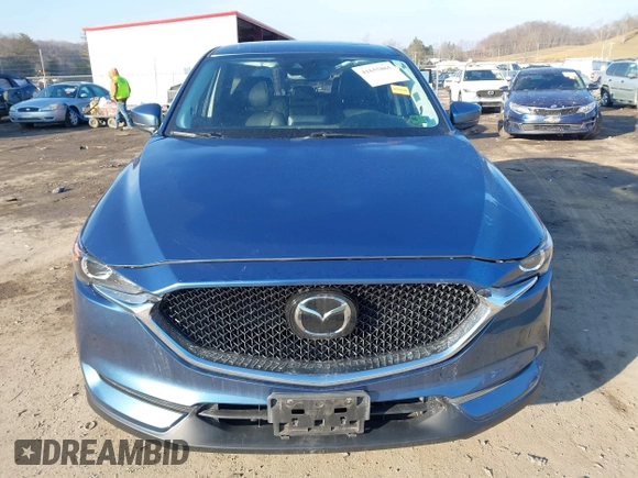 2018 Mazda CX-5 Touring z VIN JM3KFBCM2J0461954, wystawiony jako IAAI lot #41655865 z przebiegiem 129 333 mil mil oraz . Historia ofert i sprzedaży dostępna na DreamBid. Obrazek 11.