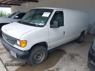 2006 Ford Econoline Cargo with VIN 1FTNE24W06HB02149, listed as a IAAI auction lot 42055924 with 229,432 mi miles and . Bid and sale history available at DreamBid. Image 2.