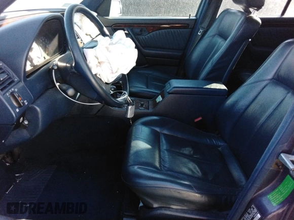 1996 Mercedes-Benz C with VIN WDBHA28E5TF406948, listed as a Copart auction lot 80234944 with 239,256 mi miles and Salvage Title. Bid and sale history available at carsss.com. Image 7.