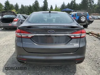 2017 Ford Fusion Titanium z VIN 3FA6P0K95HR139060, wystawiony jako Copart lot #62200755 z przebiegiem 106 133 mil mil oraz Szkoda całkowita • Salvage title. Historia ofert i sprzedaży dostępna na DreamBid. Obrazek 6.