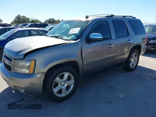 2007 Chevrolet Tahoe LTZ with VIN 1GNFC13J97R155705, listed as a IAAI auction lot 40914171 with 165,727 mi miles and . Bid and sale history available at DreamBid. Image 2.