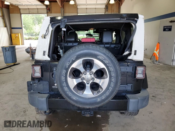 2016 Jeep Wrangler Unlimited Sahara с VIN 1C4HJWEG3GL235476, выставлен на аукционе Copart как лот 63342605 с пробегом 133 785 миль миль и Списание • Salvage title. История ставок и продаж доступна на DreamBid. Изображение 6.