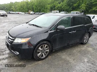 2015 Honda Odyssey Touring Elite with VIN 5FNRL5H97FB104347, listed as a Copart auction lot 60037675 with 188,756 mi miles and Salvage title. Bid and sale history available at DreamBid. Image 1.