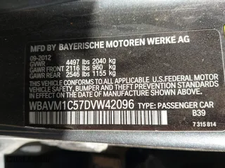 2013 BMW X1 28i with VIN WBAVM1C57DVW42096, listed as a IAAI auction lot 41572971 with 156,999 mi miles. Bid and sale history available at carsss.com. Image 9.