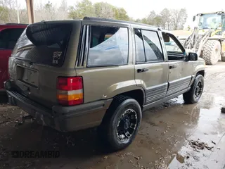1995 Jeep Grand Cherokee Laredo with VIN 1J4GZ58SXSC697003, listed as a IAAI auction lot 41259889 with 248,595 mi miles. Bid and sale history available at carsss.com. Image 4.