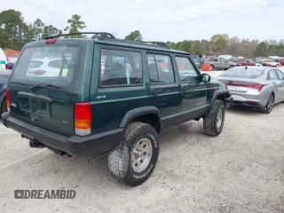 1999 Jeep Cherokee Sport with VIN 1J4FF68S1XL555463, listed as a IAAI auction lot 41898076 with 206,656 mi miles. Bid and sale history available at carsss.com. Image 4.