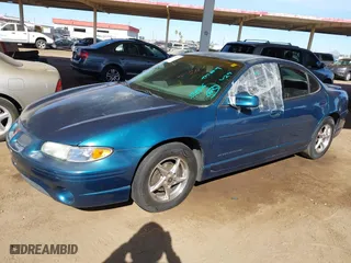 2003 Pontiac Grand Prix GT with VIN 1G2WP52K13F152876, listed as a IAAI auction lot 41426333 with 258,237 mi miles. Bid and sale history available at carsss.com. Image 2.