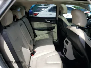 2015 Ford Edge Titanium z VIN 2FMPK3K85FBC05782, wystawiony jako Copart lot #56356595 z przebiegiem 165 202 mil mil oraz Szkoda całkowita • Salvage title. Historia ofert i sprzedaży dostępna na DreamBid. Obrazek 11.