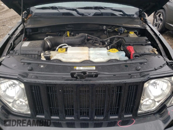 2012 Jeep Liberty Sport z VIN 1C4PJMAKXCW186540, wystawiony jako Copart lot #57848545 z przebiegiem 97 971 mil mil oraz Szkoda całkowita • Salvage title. Historia ofert i sprzedaży dostępna na DreamBid. Obrazek 11.