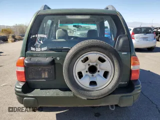 2000 Suzuki Vitara JX z VIN 2S3TD52V1Y6108459, wystawiony jako Copart lot #75526644 z przebiegiem 263 433 mil mil oraz Szkody całkowita. Historia ofert i sprzedaży dostępna na DreamBid. Obrazek 6.