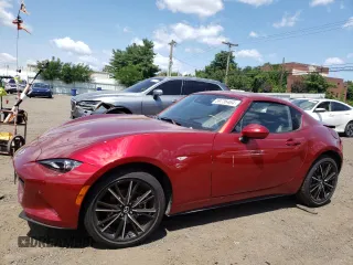 2024 Mazda MX-5 Miata Grand Touring z VIN JM1NDAM75R0601120, wystawiony jako Copart lot #59736464 z przebiegiem Nie podano mil oraz Szkoda całkowita • Salvage title. Historia ofert i sprzedaży dostępna na DreamBid. Obrazek 1.