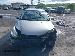 2012 Ford Focus SE z VIN 1FAHP3K27CL241013, wystawiony jako IAAI lot #42198812 z przebiegiem 121 888 mil mil oraz . Historia ofert i sprzedaży dostępna na DreamBid. Obrazek 13.