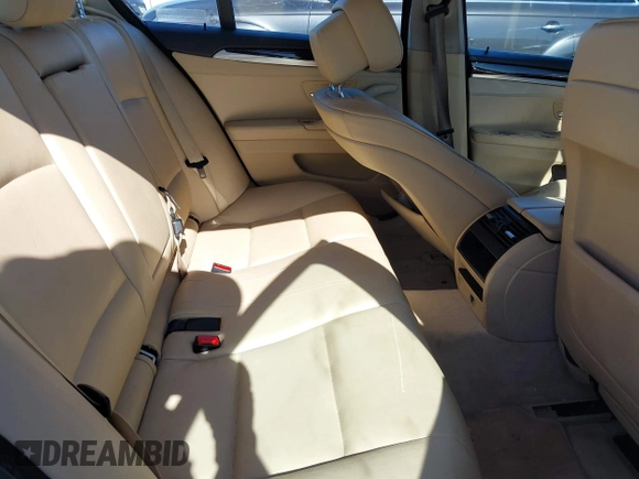 2013 BMW 5 Series 528i with VIN WBAXG5C56DDY31982, listed as a IAAI auction lot 40906428 with 248,336 mi miles and . Bid and sale history available at carsss.com. Image 8.