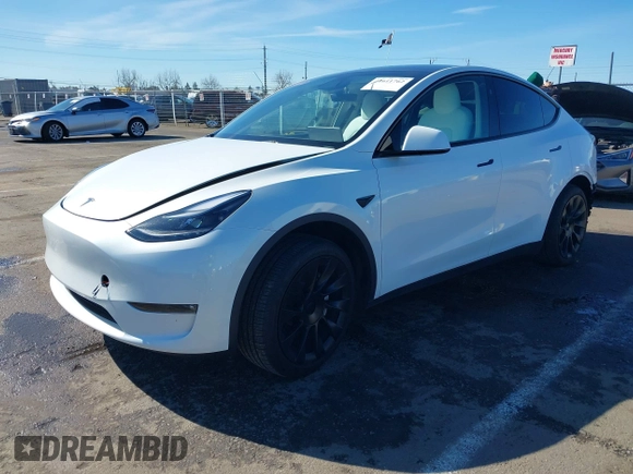 2023 Tesla Model Y Long Range with VIN 7SAYGDEE0PF945202, listed as a IAAI auction lot 41611762 with 7,316 mi miles and . Bid and sale history available at DreamBid. Image 17.