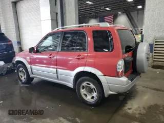 2004 Suzuki Grand Vitara LX z VIN JS3TD62V444101460, wystawiony jako Copart lot #70063234 z przebiegiem 113 618 mil mil oraz Szkoda całkowita • Salvage title. Historia ofert i sprzedaży dostępna na DreamBid. Obrazek 2.